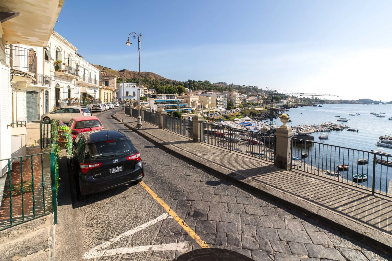 The seafront road along the coast at Aci Castello