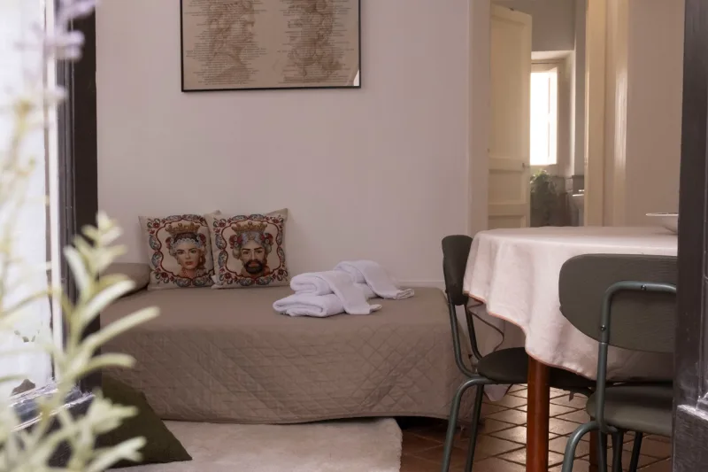 Living area with sofa bed and dining table
