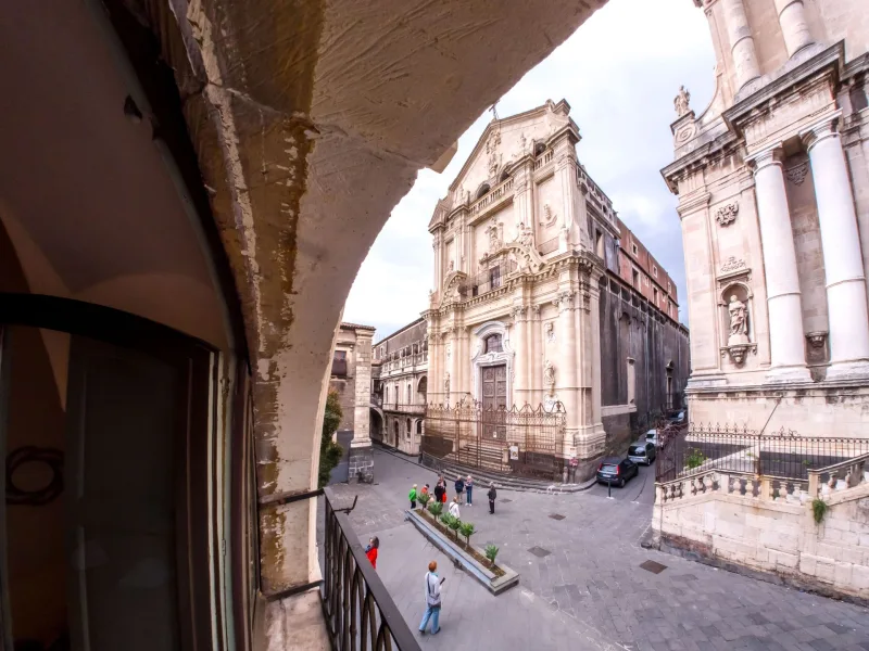 View from the balcony arch onto a Baroque church in Catania