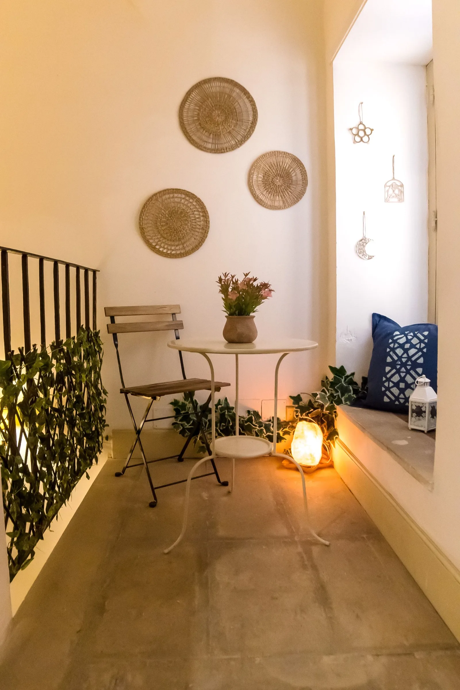 Lantern-lit balcony with bistro table