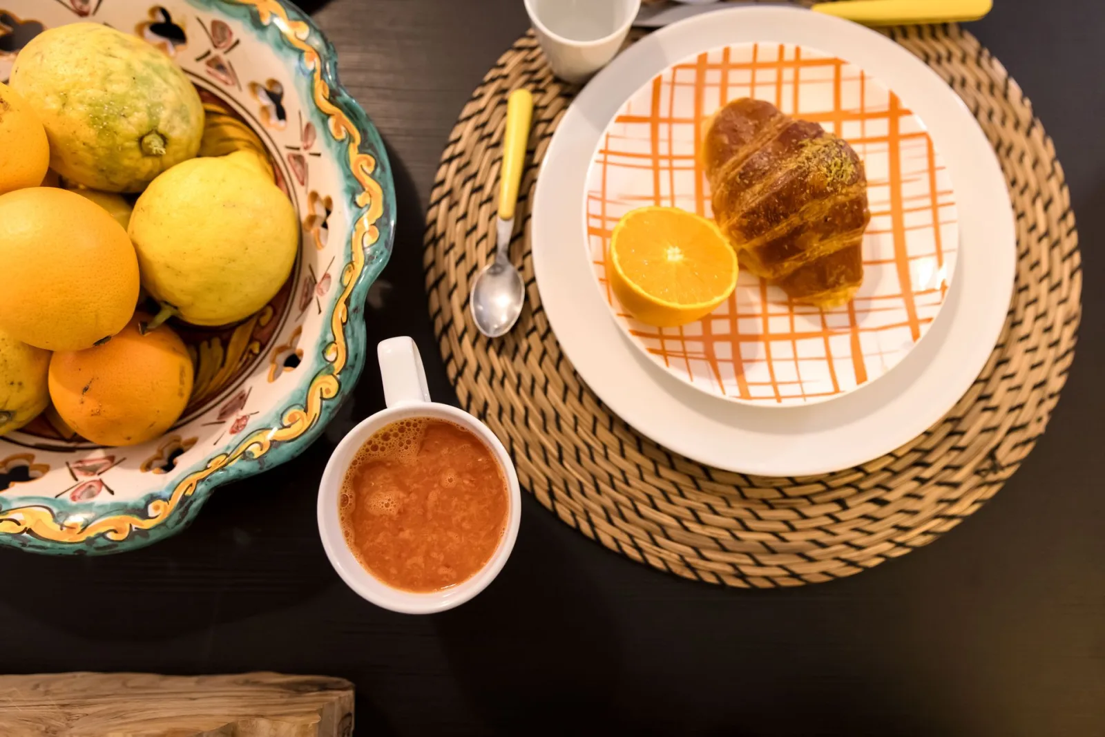 Breakfast with croissant and oranges