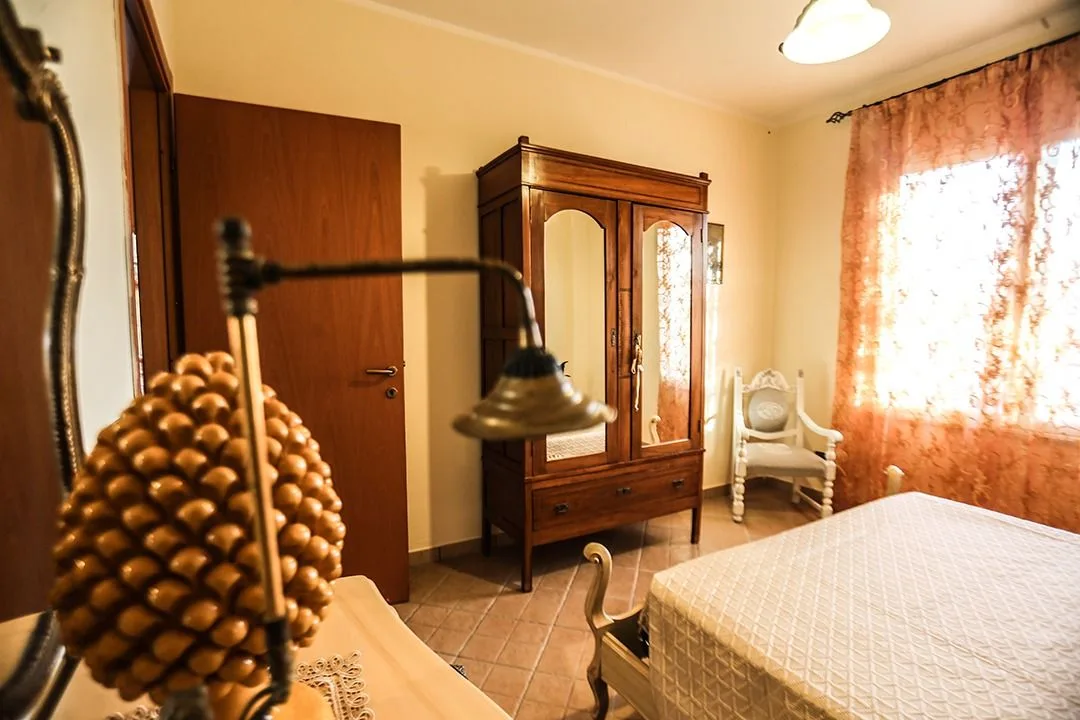 Bedroom with ceramic pine cone and wardrobe